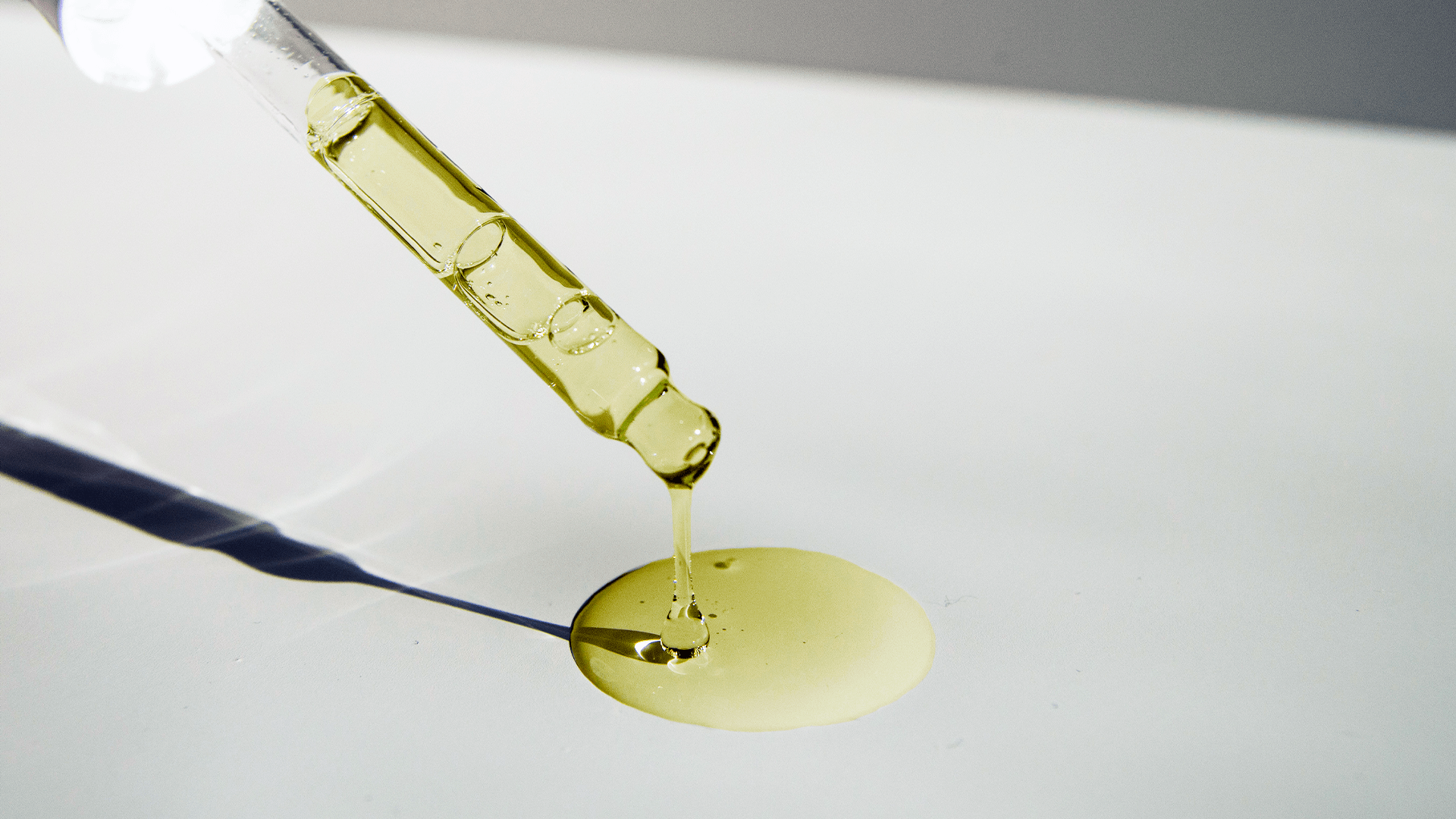 Oil coming from a glass dropper
