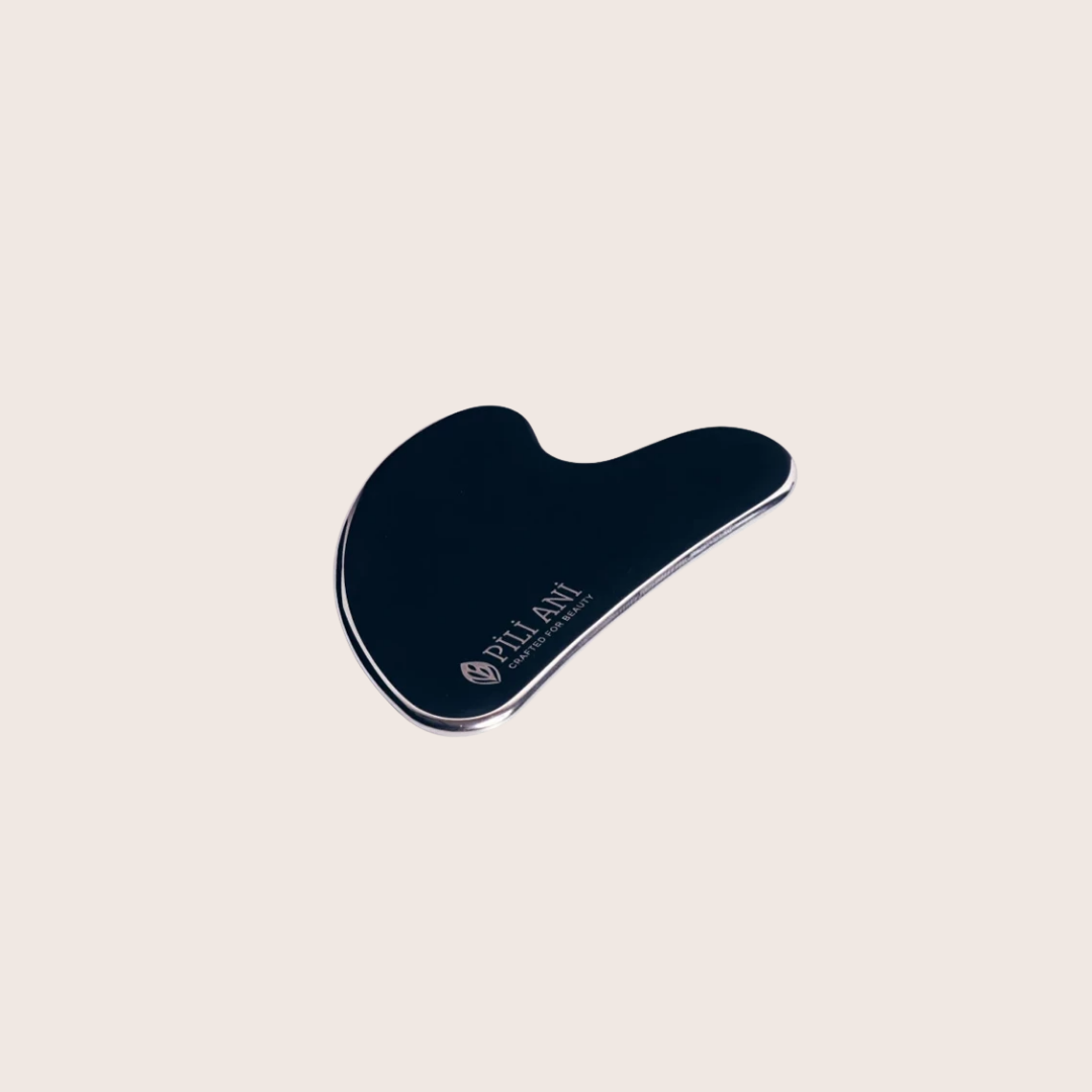 Pili Ani Gua Sha tool to boost circulation, smooth fine lines, and define natural facial contours.