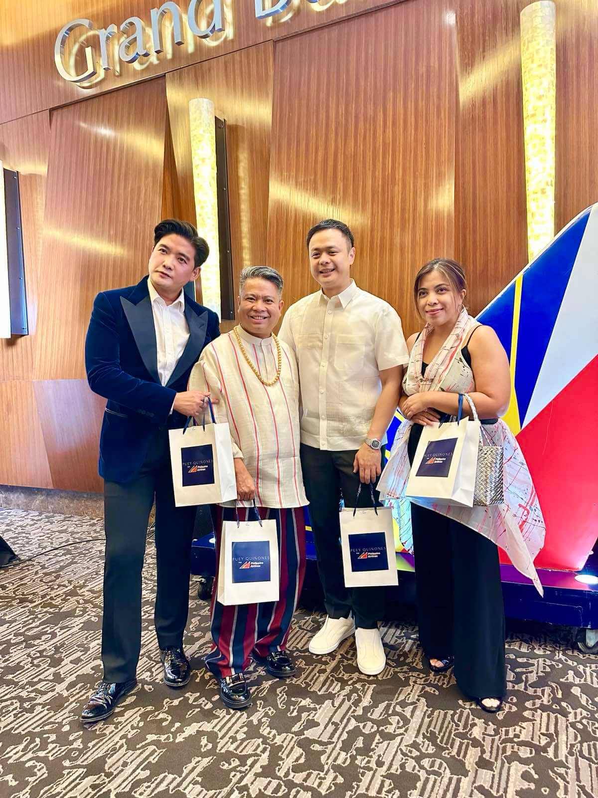 President of PAL, Captain Stanley Ng together with Tim Yap and Puey Quiñones, a fashion designer of international renown.