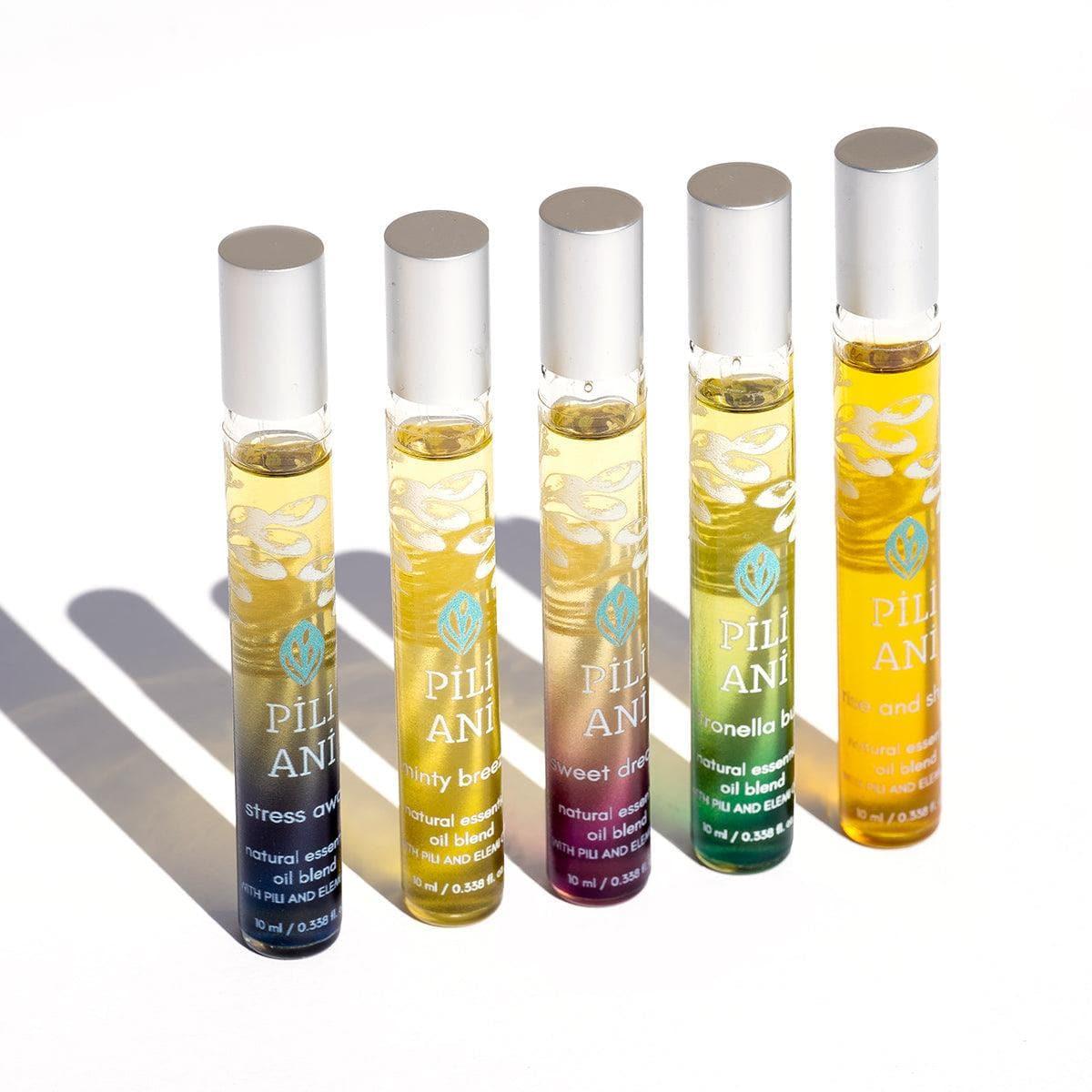 Best essential oil travel kit for skin hydration, Natural aromatherapy oils for on-the-go use, Pili Ani essential oils for wellness, Essential oil roller set for relaxation, Aromatherapy travel kit with Pili oil